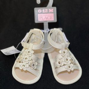 Sandals. 6-12 mths. Cream w/flowers. Never worn.